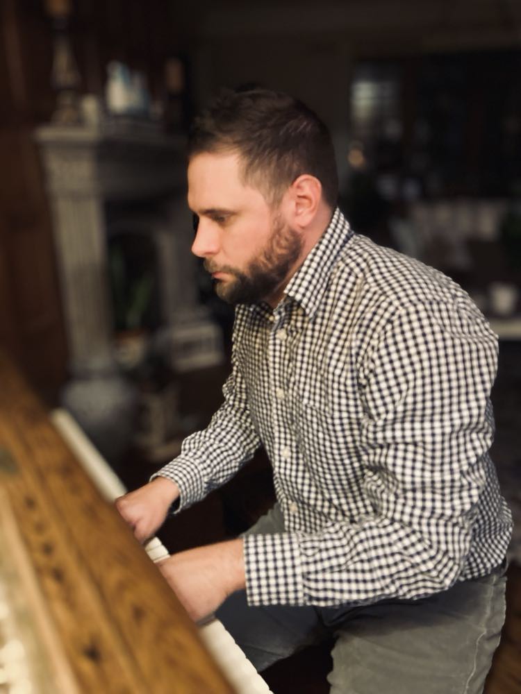 Picture of Jeff Rubleski by his piano